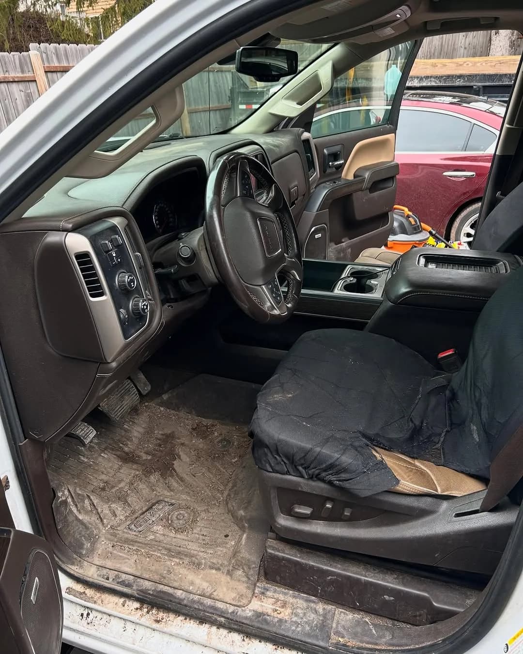 GMC Denali driver area before full interior detailing