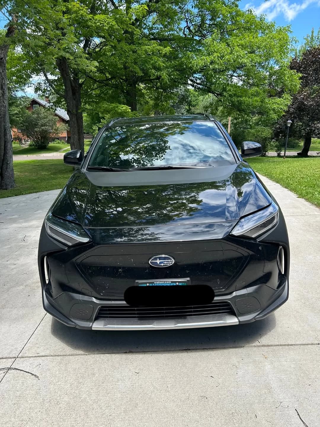 Black Subaru Solterra after exterior detailing and paint correction
