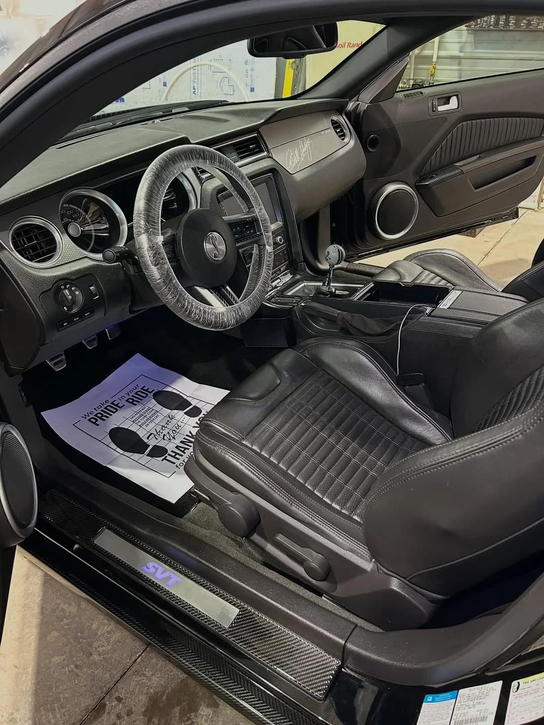 Clean black Shelby GT500 cabin after detailing