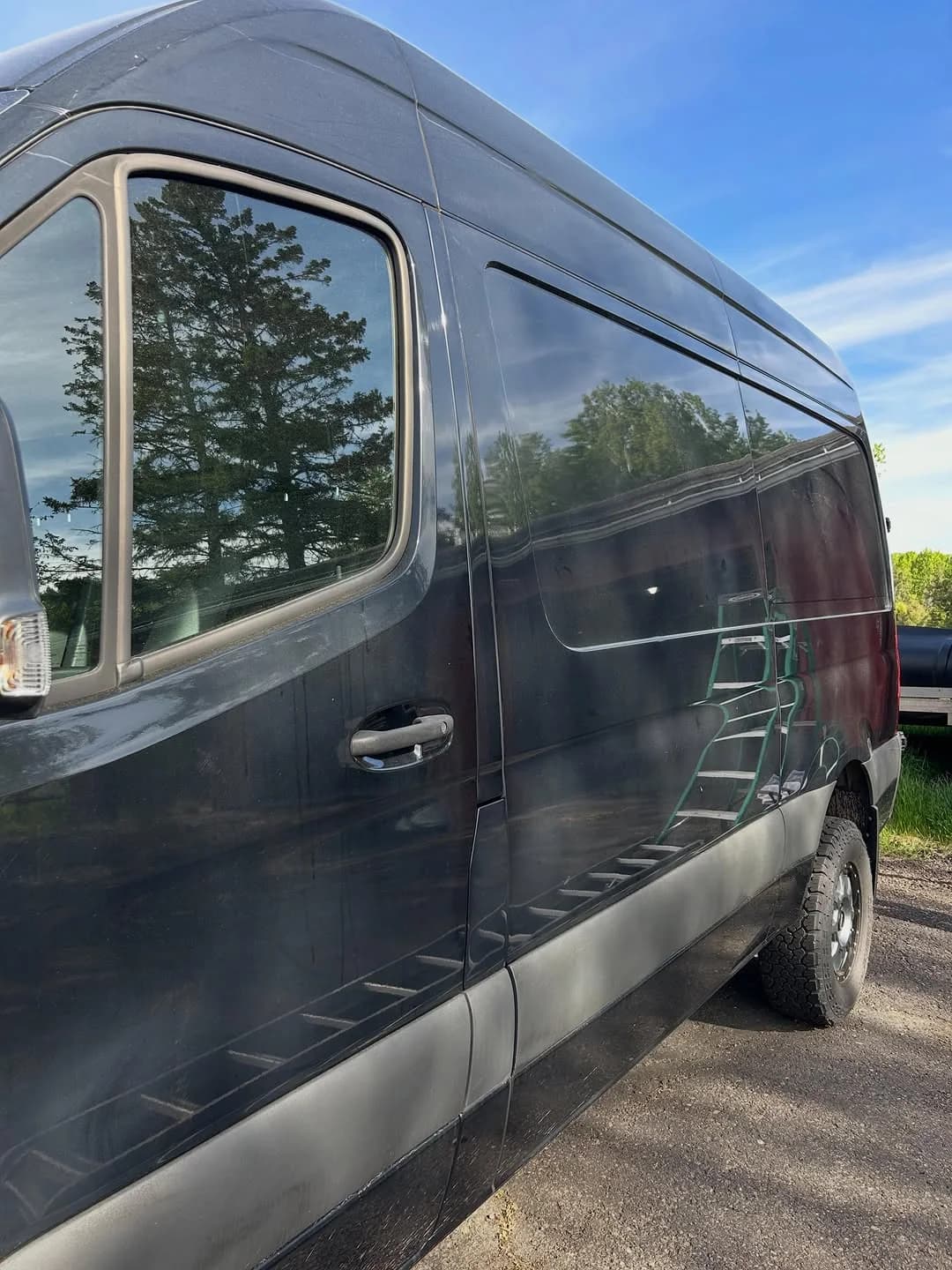 Corrected side finish on a black Mercedes-Benz Sprinter